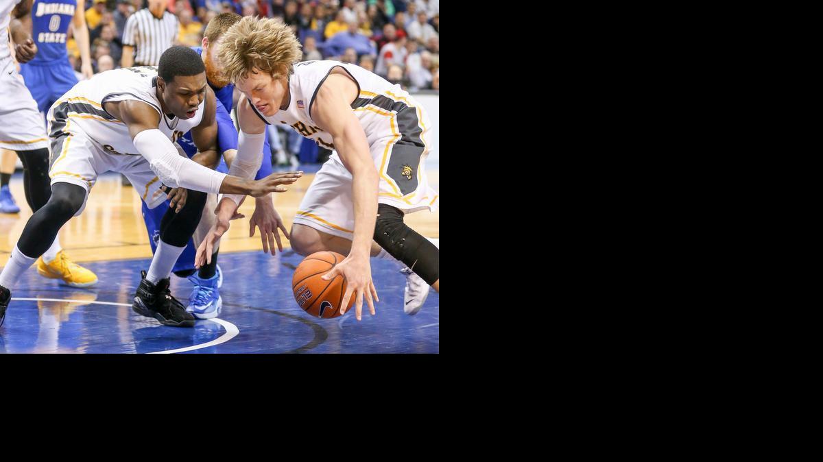 WSU's Cleanthony Early, left, and Ron Baker chase down a loose ball against Indiana State in last Sunday’s MVC final.


