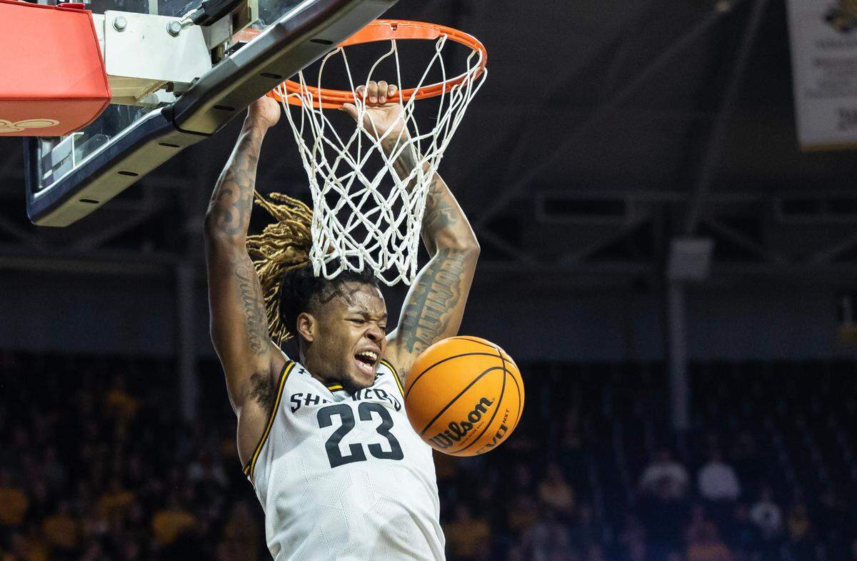 Wichita State’s Gus Okafor dunks the ball during the first half of their game against South Florida on Sunday. It was WIchita State’s final regular season game.