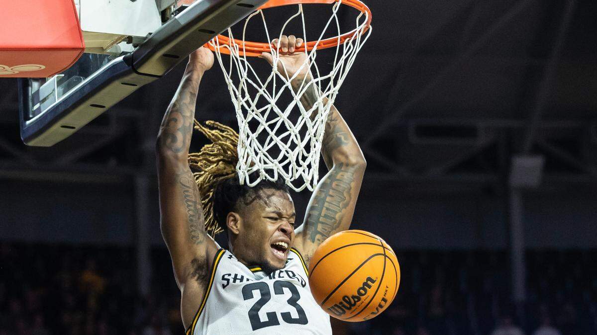 Wichita State’s Gus Okafor dunks the ball during the first half of their game against South Florida on Sunday. It was WIchita State’s final regular season game.