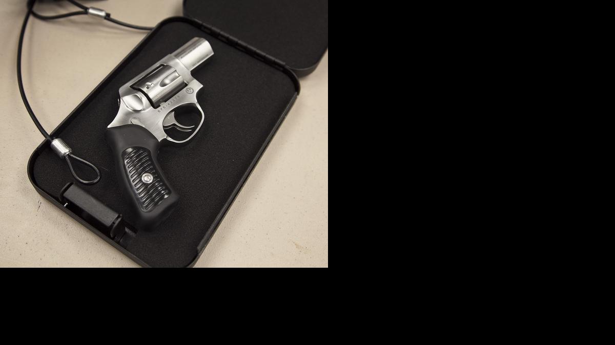 A flip-open gun lock box can be secured by the cable under a car seat or bed frame and locked with either a key or combination lock. Most area sporting goods retailers and gun shops provide a variety of quick access handgun safes like these at Bullseye. (May 1, 2014) 

