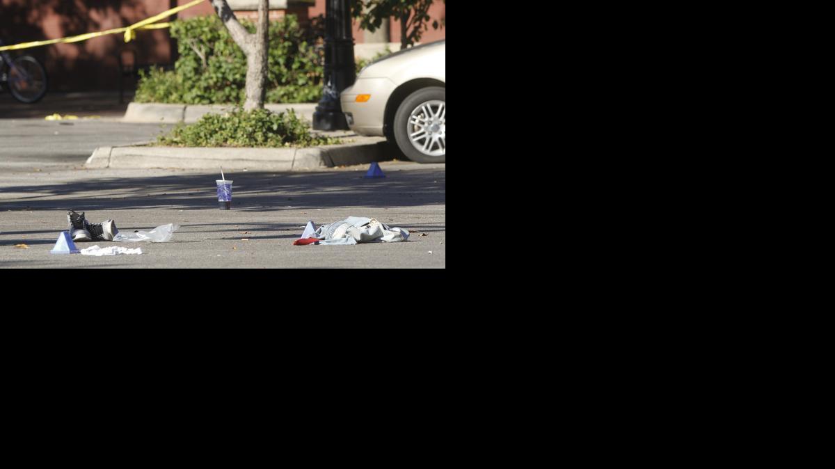 Evidence marked by the Wichita police in a parking lot in the 100 block of Rock Island in Old Town. A shooting occurred there early Sunday morning leaving at least six people injured. (Sept. 22, 2013)

