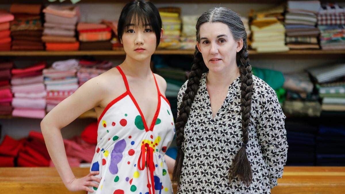Malissa Long, right, stands with model Kaylee Thamrin at MakeICT. Long is a Wichita-based designer who will show this dress, and others, at Kansas City Fashion Week in April.