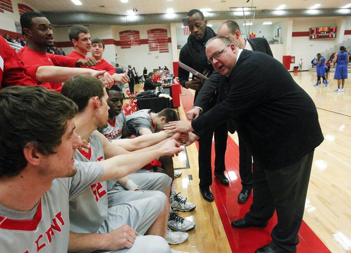 Friends coach Dale Faber talks with his players before their game with Tabor at Friends University Wednesday. (Jan 22, 2014)