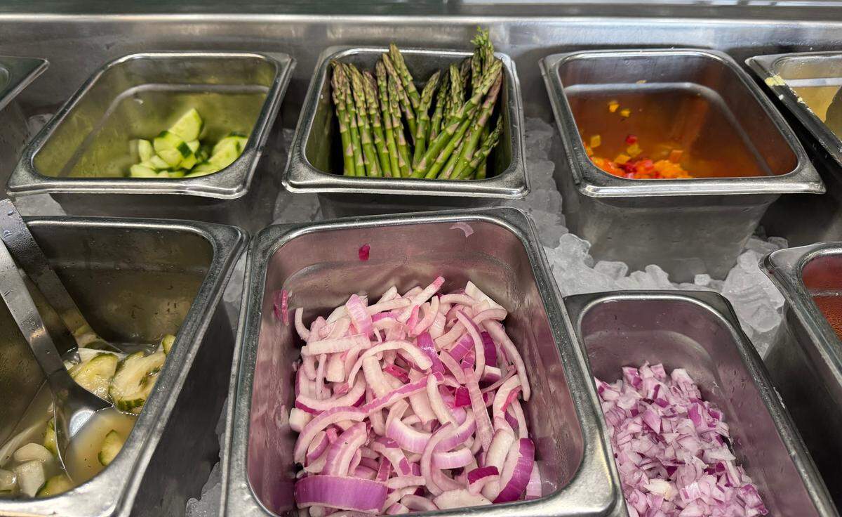 The salad bar at Plentibloom Market & Cafe inside the Ruffin Building in downtown Wichita has options like fresh asparagus spears and homemade pickles.