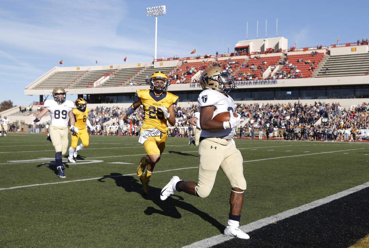 St. Thomas Aquinas’ Tyron Young scores a touchdown in the 3rd quarter of the 5A state title game against Wichita Northwest on Saturday in Pittsburg. 