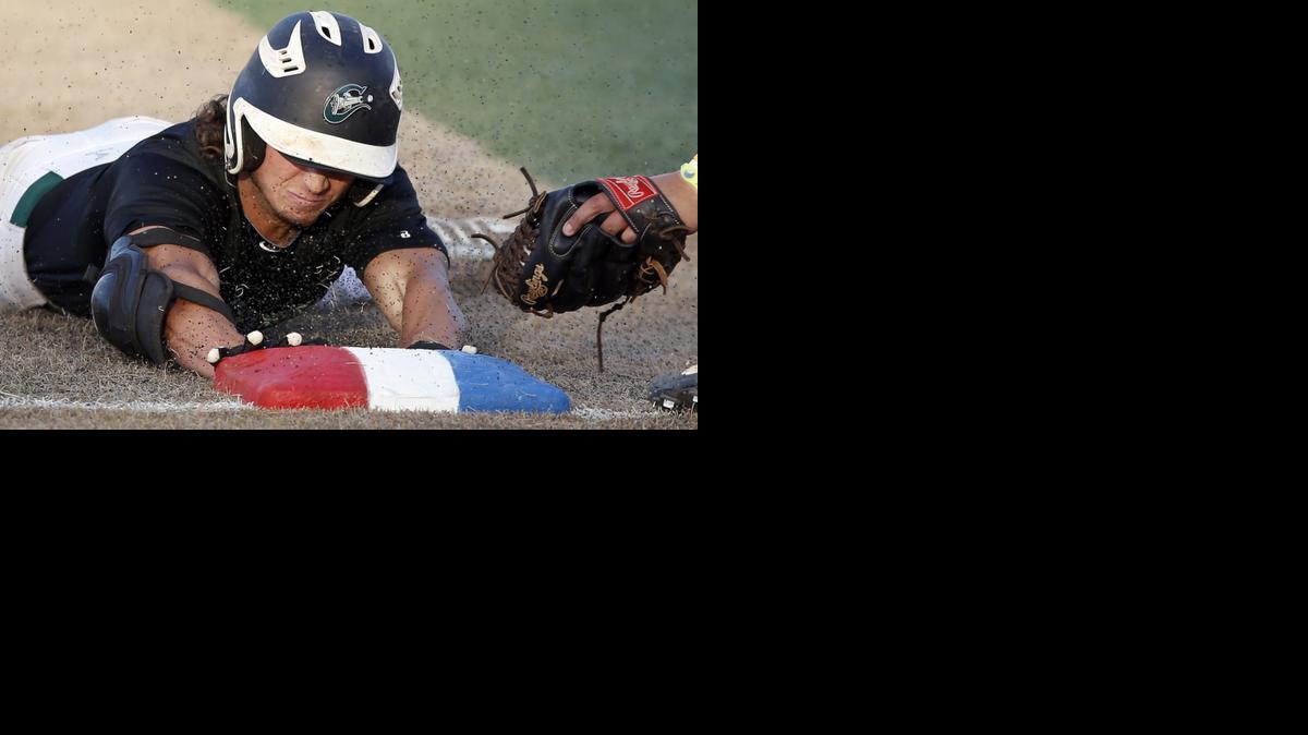 Kansas Cannons' Taylor Herrington slides safely into third base after hitting a triple against the Park City Rangers during the National Baseball Congress World Series on Monday night at Lawrence-Dumont Stadium. 

