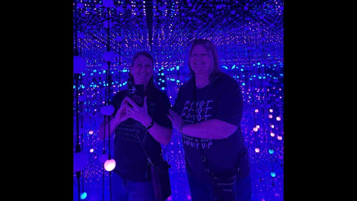 Stephanie Purcell (right) and her sister, Denise Allison, pose for a photo during their trip to Denver. Purcell died and Allison was injured in a March 14 wreck in western Kansas.