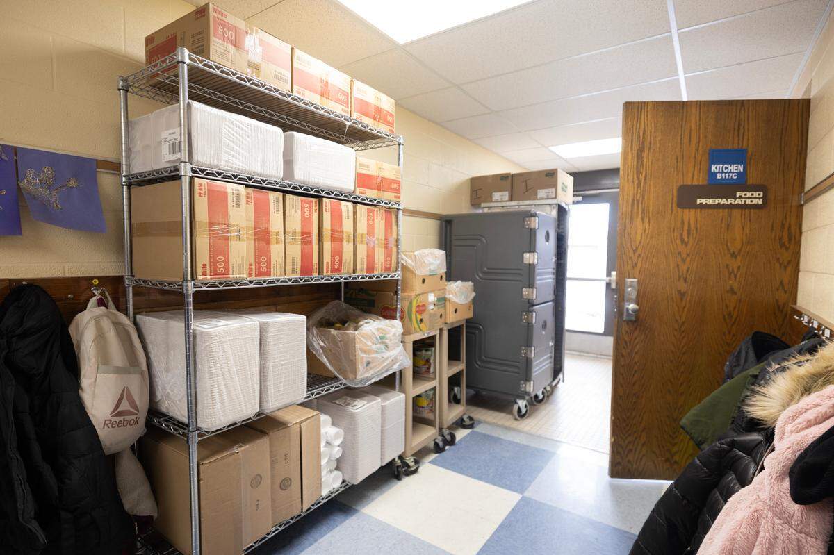 Irving Elementary School has little storage space, so food items are piled up in a hallway.