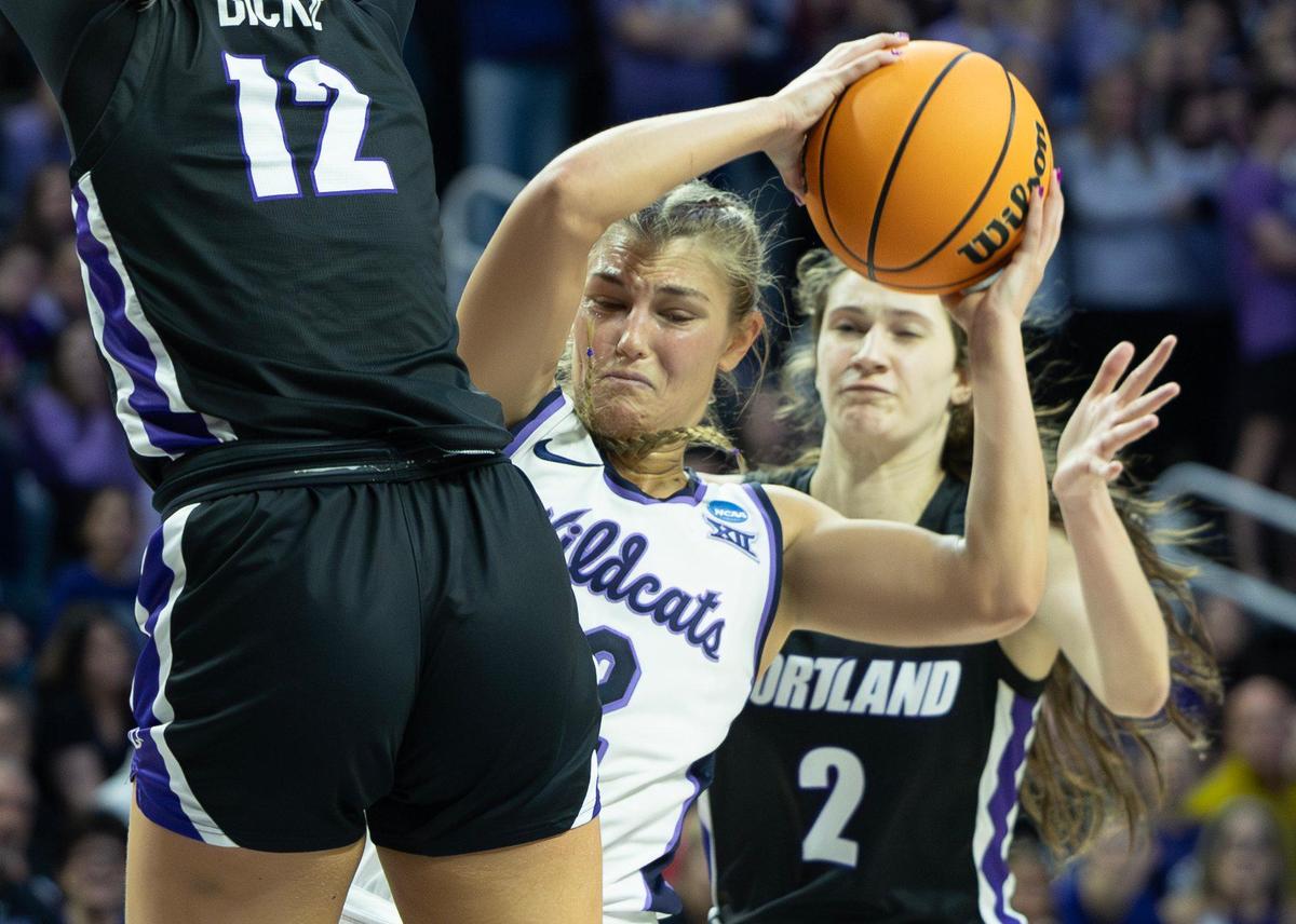 Kansas State’s Gabby Gregory gets squeezed between Portland defenders Kennedy Dickie, left, and Dani Ananiev during the third quarter of their NCAA Tournament game on Friday in Manhattan.