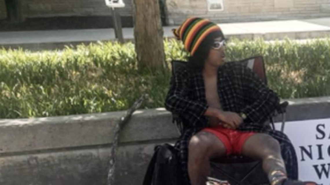 This guy showed up on the campus at Kansas State University in full-body blackface makeup with a sign inviting students to say the N-word and win candy. One did, and got slapped in the face by another student.