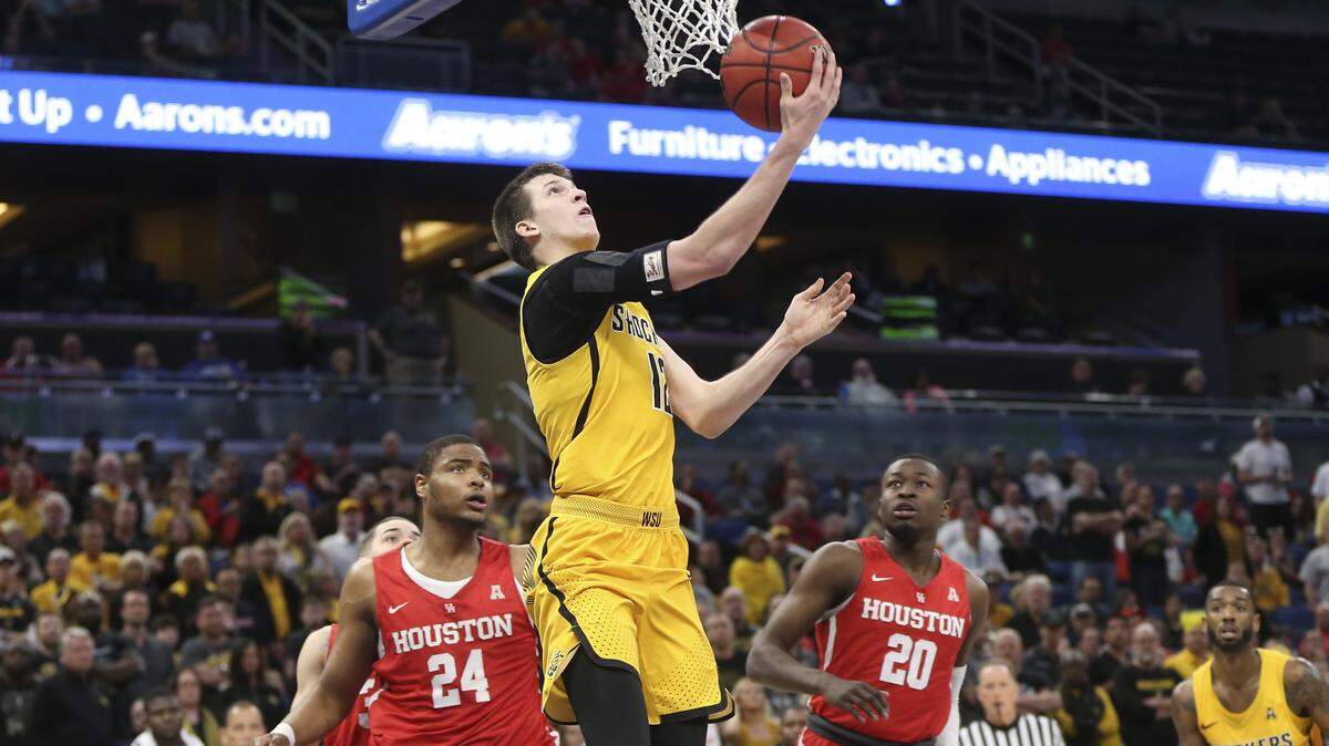 Wichita State guard Austin Reaves took a shot against Houston during the first half of an AAC Tournament semifinal game March 10 in Orlando, Fla. Reaves recently announced he had decided to transfer from Wichita State.