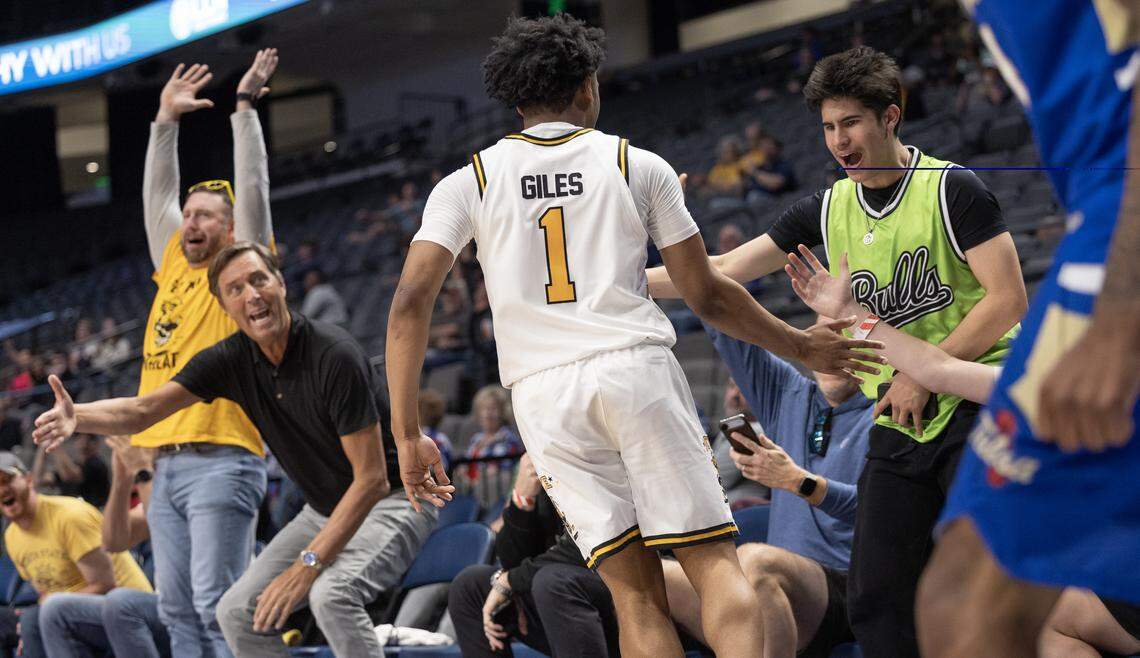 Wichita State celebrates with fans after hitting another 3-pointer during the second half of an AAC tournament semifinal game against Tulsa on Saturday in Birmingham.