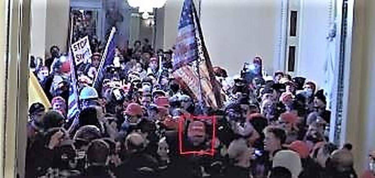 A federal arrest warrant affidavit says the man outlined by the red square in this security image is Michael Eckerman of Wichita, who is charged with multiple crimes during the Jan. 6 riot at the nation’s Capitol.
