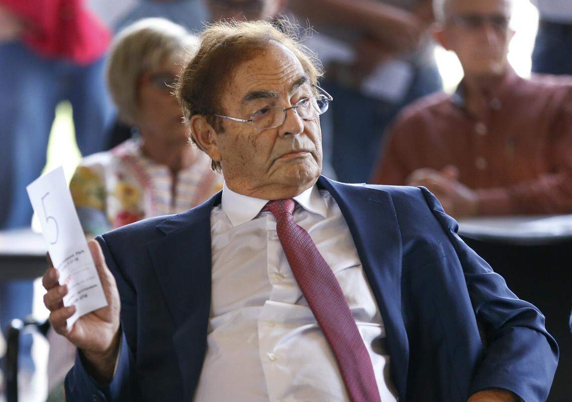Phil Ruffin bids on the land where his former Wichita Greyhound Park used to be during a county auction at Fire Station 32 in Park City on Tuesday, July 17, 2018.
