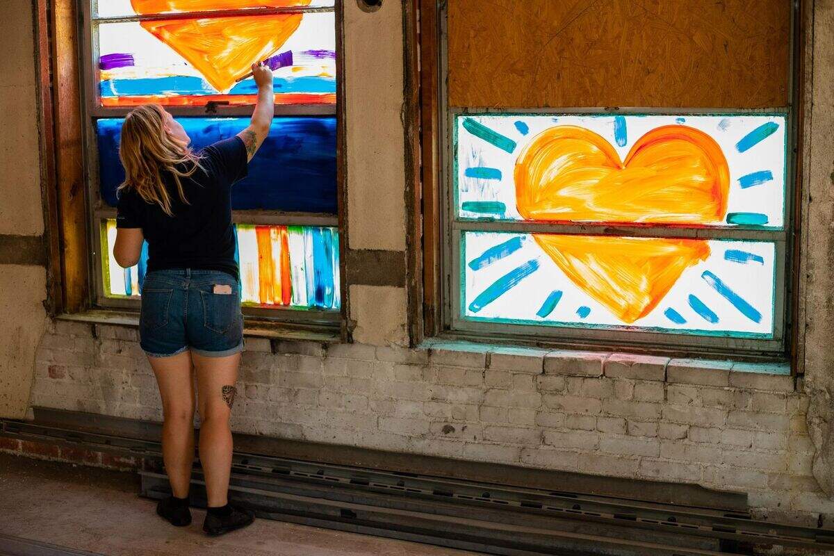 Delilah Reed lead a project that filled the windows on the old Caldwell Murdock building on East Douglas with color.