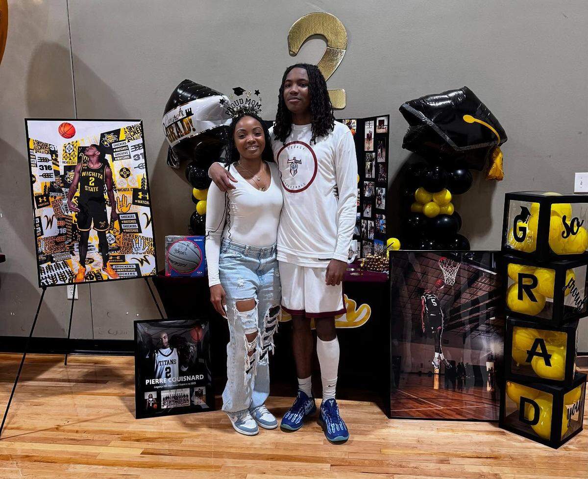 Pierre Couisnard poses for a picture with his mother, Veronica Lockett, during his senior day ceremony where he officially committed to Wichita State.
