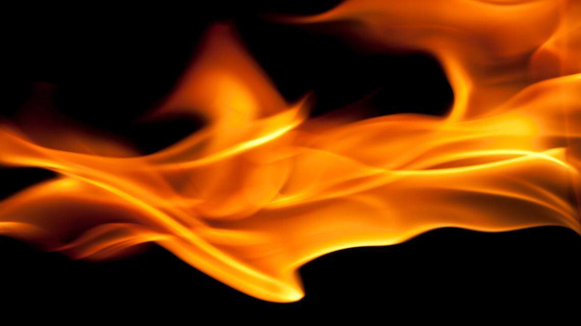 Person found dead as crews put out fire along river in south Wichita