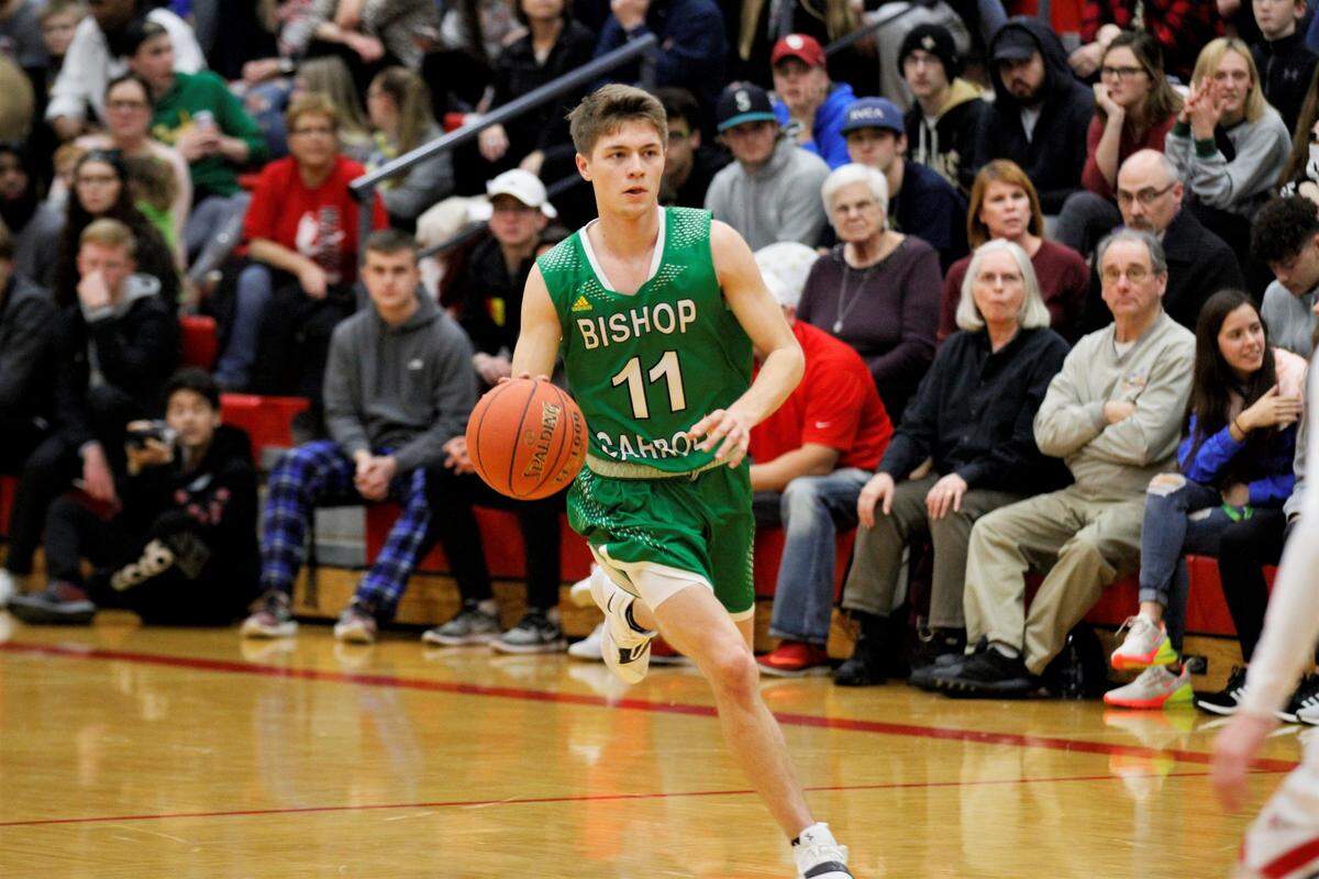 Bishop Carroll senior guard Carsen Pracht runs down the court on a fastbreak during the Golden Eagles’ 56-52 overtime loss to Maize on Friday as part of the AVCTL/GWAL Challenge. (Jan. 11, 2019)