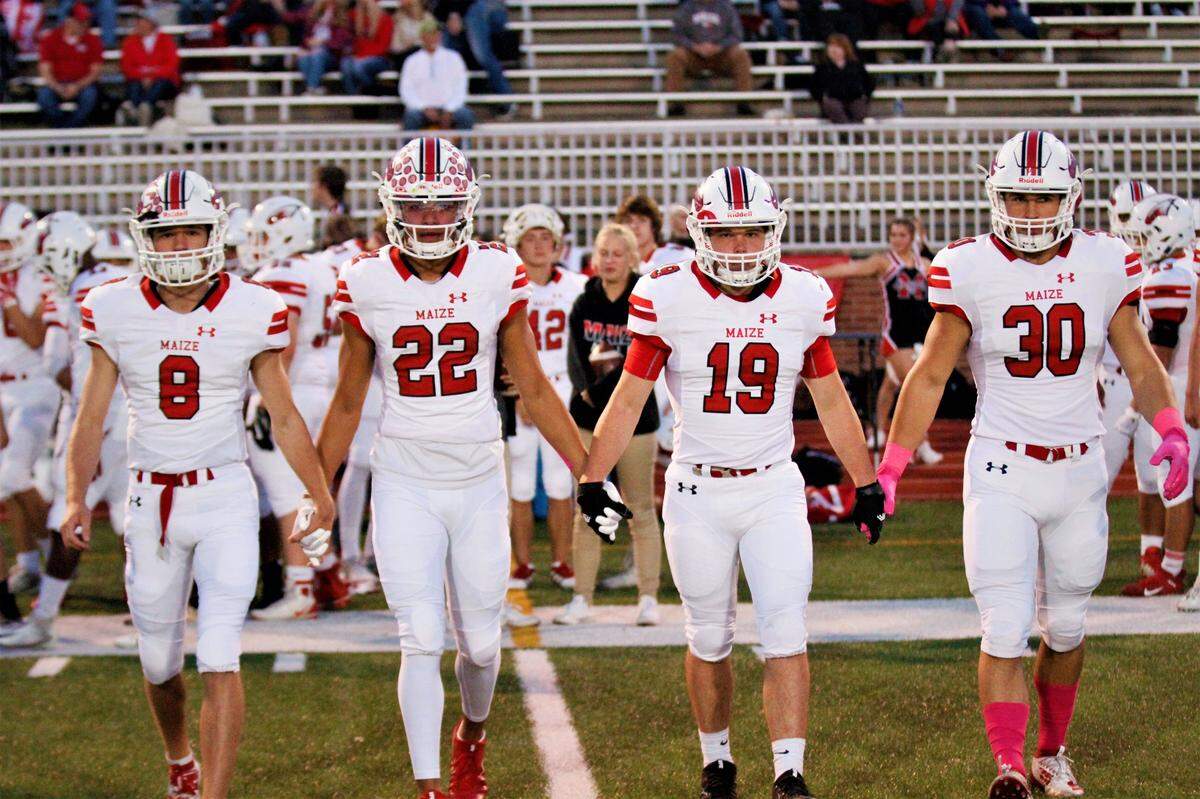 Maize captains Camden Jurgensen, Preven Christon, Carson Wheeler and Kyle Haas