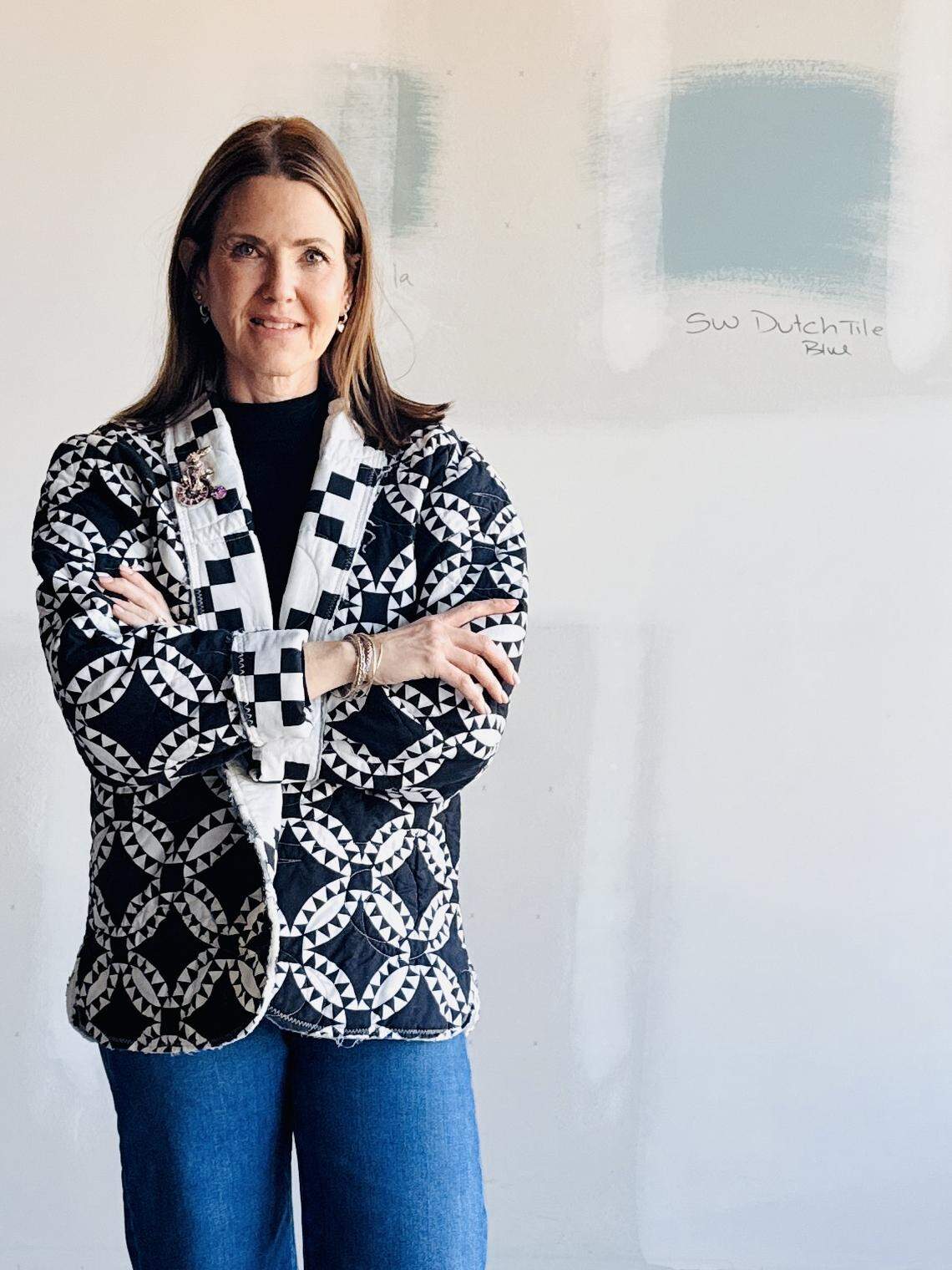 Julie Gaston, owner of the new Quilted Rabbit Fabric Shop, in a jacket she made from a quilt.