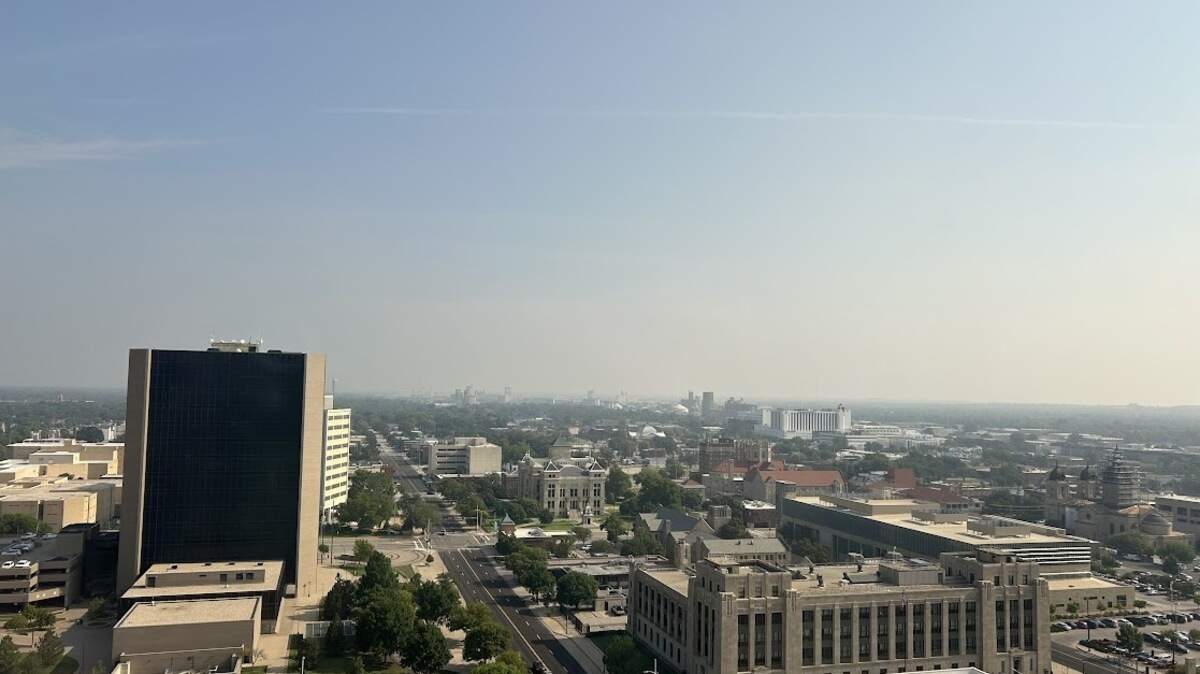 Smoke moving in from Canadian wildfires can be seen Friday morning across the Wichita skyline.