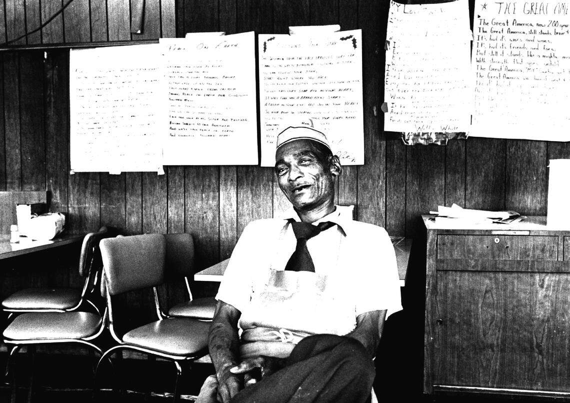 Willie White, the owner of Pit’s Bar-B-Q, would write song lyrics and poetry on poster-sized sheets of paper and tack them on the wall of his restaurant. He’s pictured here in 1982.