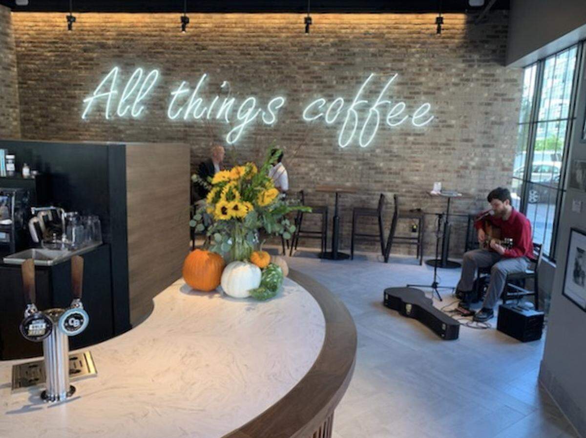 Walt toward the neon “All Things Coffee” sign and turn left and you’ll find a hidden cove of seating inside the new downtown Wichita Starbucks.