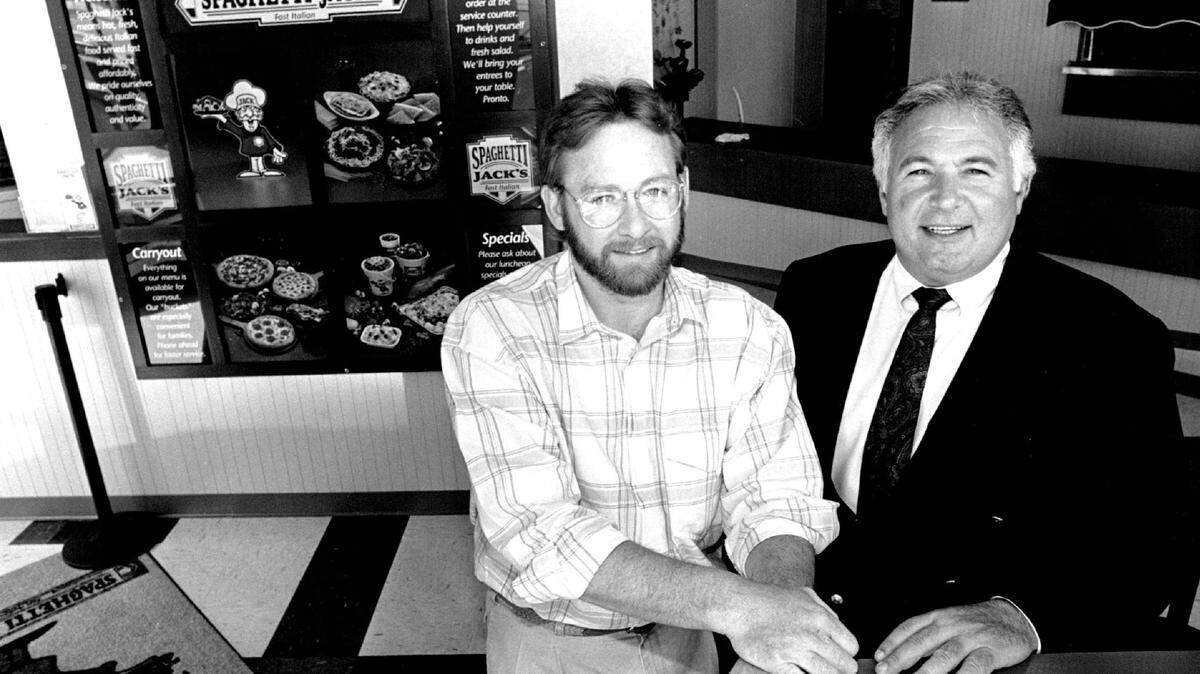 Louis Stoico, right, founded both Sub & Stuff and Spaghetti Jack’s. He’s pictured in 1992 with Gary Poulton, who was his company’s executive vice president.