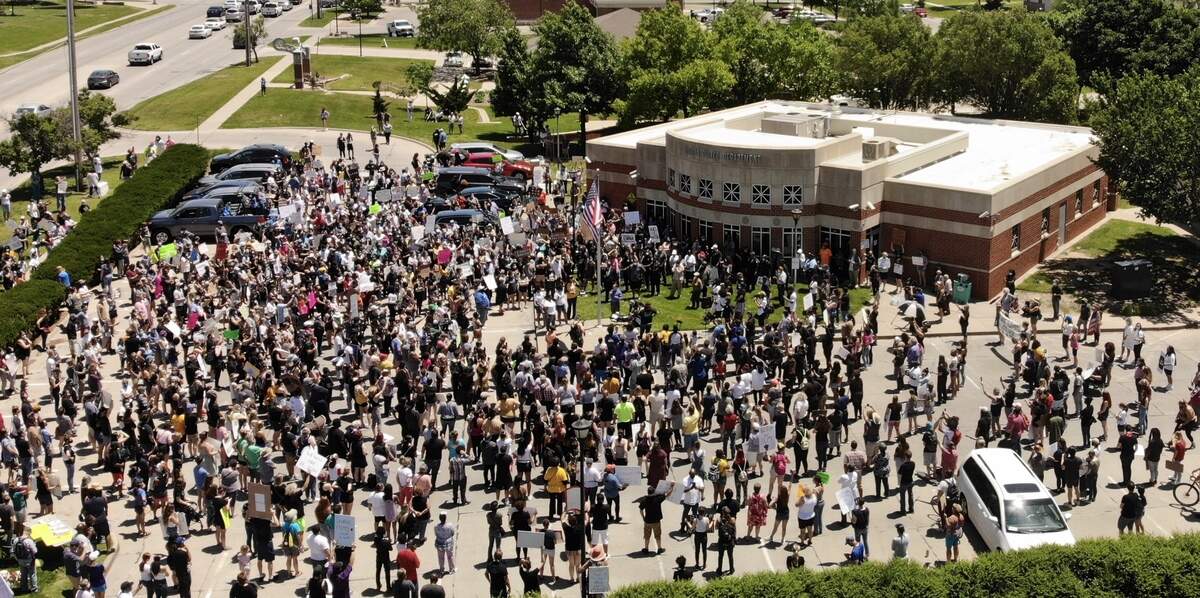 People gather outside of the police substation on East 21st Street for a demonstration titled “Justice for Floyd.” It included speeches by Wichita Police Chief Gordon Ramsay and City Council member Brandon Johnson.