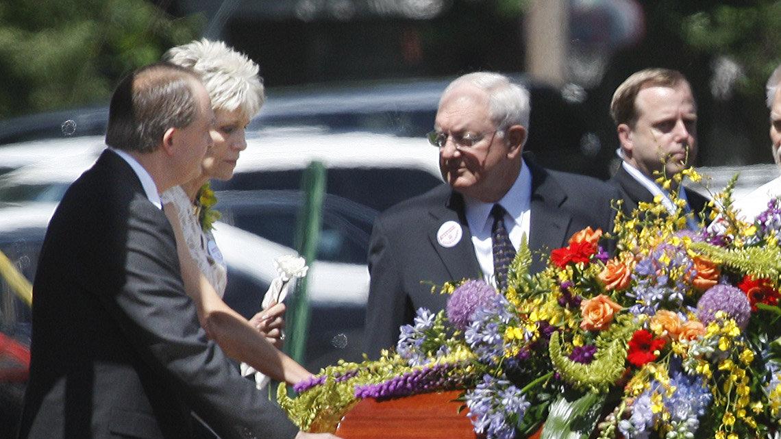 Jeanne Tiller, far left, escorts her late husband's casket from College Hill United Methodist Church after the service for Dr. George Tiller, who was shot last Sunday.