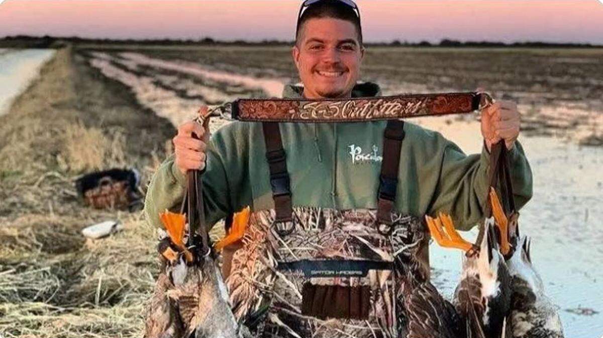 Jesse Pitcher holds up geese that he shot. The 30-year-old died in the crash of Flight 5342 as he was flying home to Maryland after a hunting trip in Kansas.