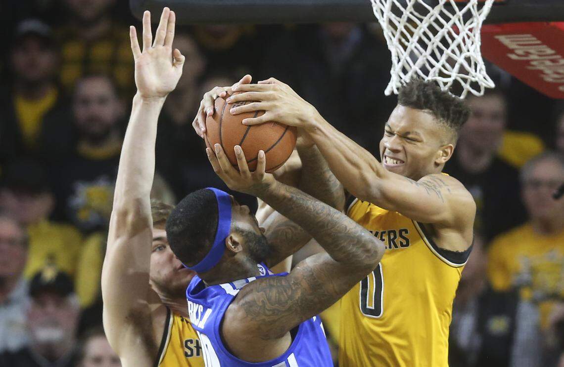 Wichita State guard Dexter Dennis blocked the shot of Memphis forward Mike Parks Jr. during the first half of their game at Koch Arena on Saturday.