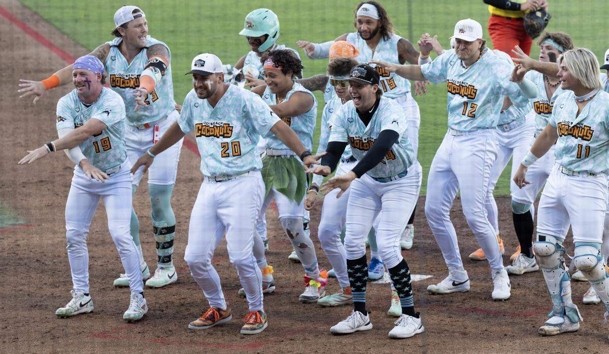 The Loco Beach Coconuts performed a group dance after scoring a run against the Firefighters at Equity Bank Park on Thursday night. The stadium was sold out at 11,400 people attended.