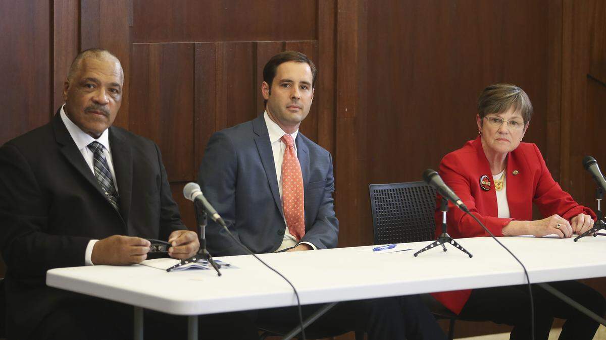 Democratic candidates for governor of Kansas listen to the moderator prior to a debate at The Lux in Wichita on Friday evening. Carl Brewer, left, Josh Svaty, middle, and Laura Kelly are all hoping to win their party's primary on Aug. 7.