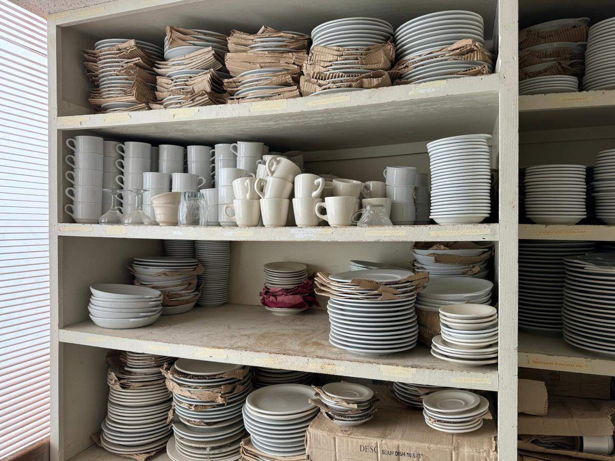 Dishes are stacked in the kitchen of the abandoned sixth-floor restaurant space at the Red Roof Plus, 7335 E. Kellogg.