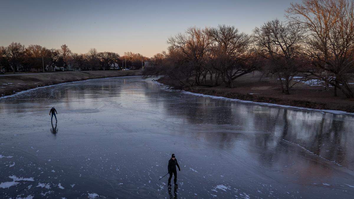 Jennifer Strong McConachie, right, and her husband, Parker, skate on the frozen Arkansas River during a recent spell of sub-zero weather. McConachie’s new book, “Go Multisport: Add Fun, Challenge and Exploration to Your World,” offers a lot of ways to find adventures close to home.