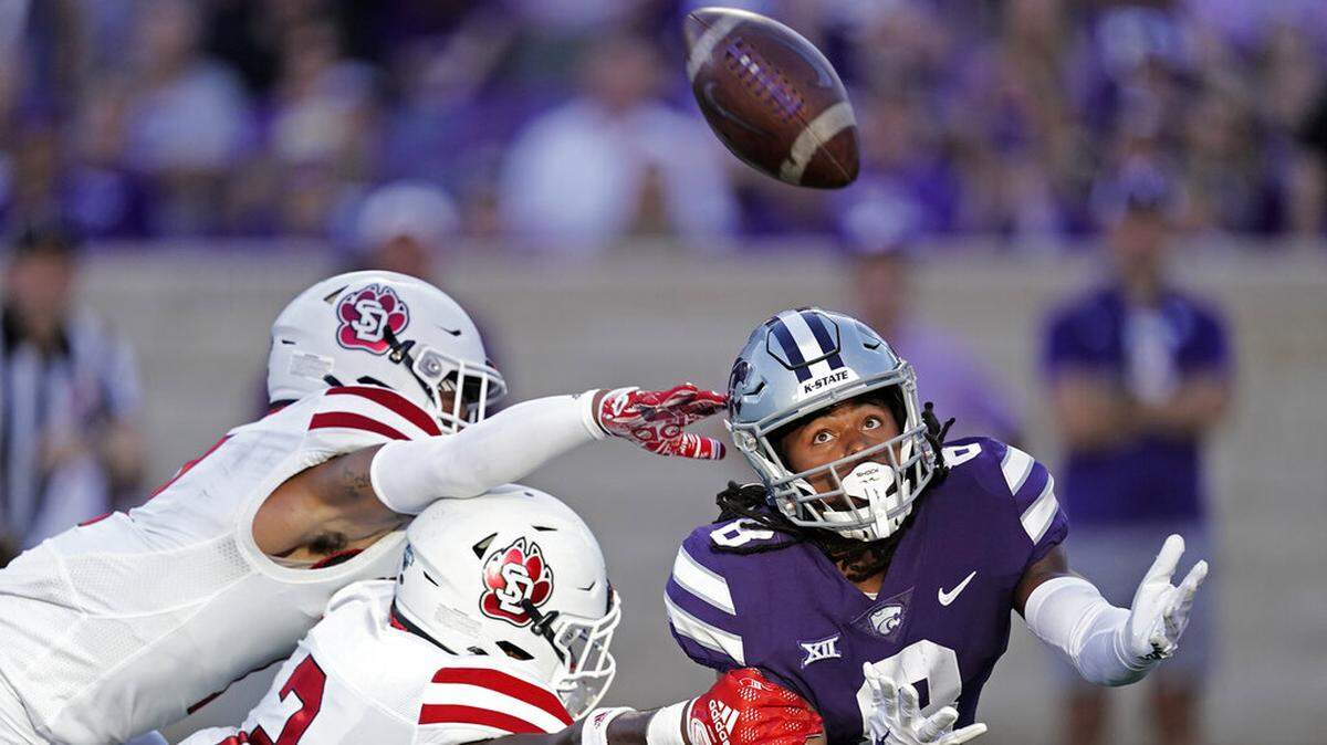 South Dakota defensive back Dennis Shorter (2) breaks up a pass intended for Kansas State wide receiver Phillip Brooks (8) during the first half of an NCAA college football game Saturday, Sept. 3, 2022, in Manhattan, Kan. (AP Photo/Charlie Riedel)