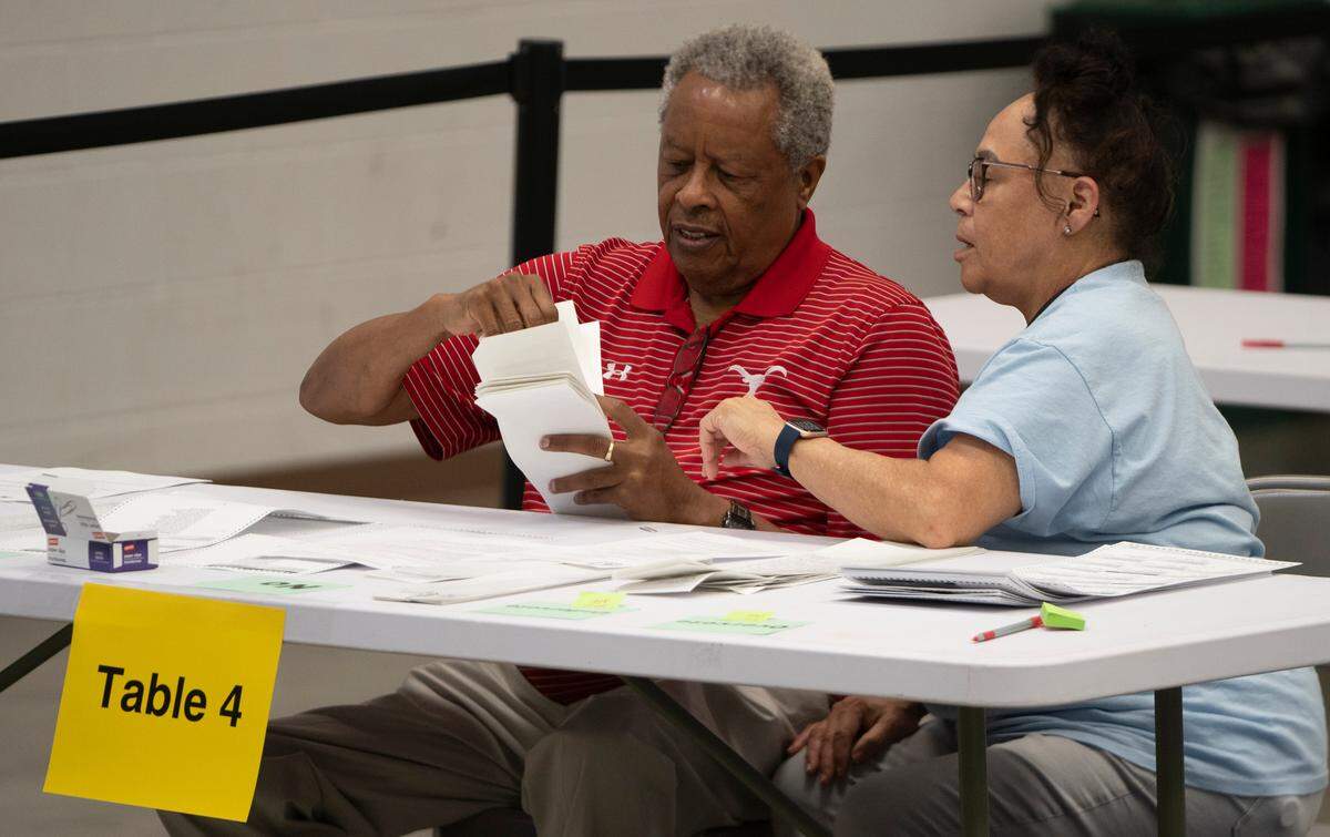 Bipartisan counting teams prepare to recount nearly 150,000 ballots at the Sedgwick County Extension Center on a constitutional amendment that would’ve removed abortion rights from the Kansas Constitution.