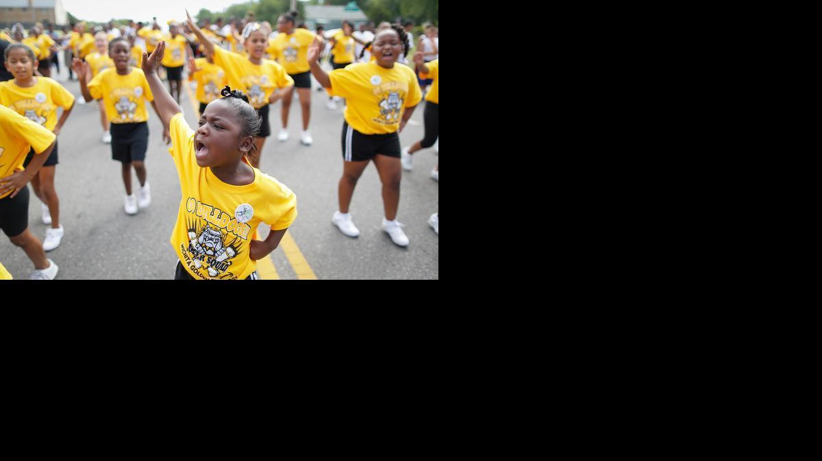 Karma Morris walks with her cheerleading squad in the Black Arts Festival parade in 2013.

