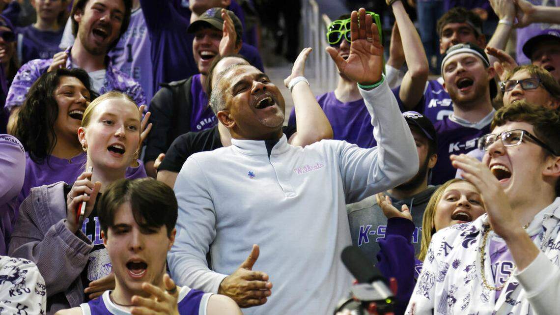 Kansas State head coach Jerome Tang, center, celebrates his team’s 75-65 win over Baylor with fans on Tuesday, Feb. 21, 2023, in Manhattan, Kan.
