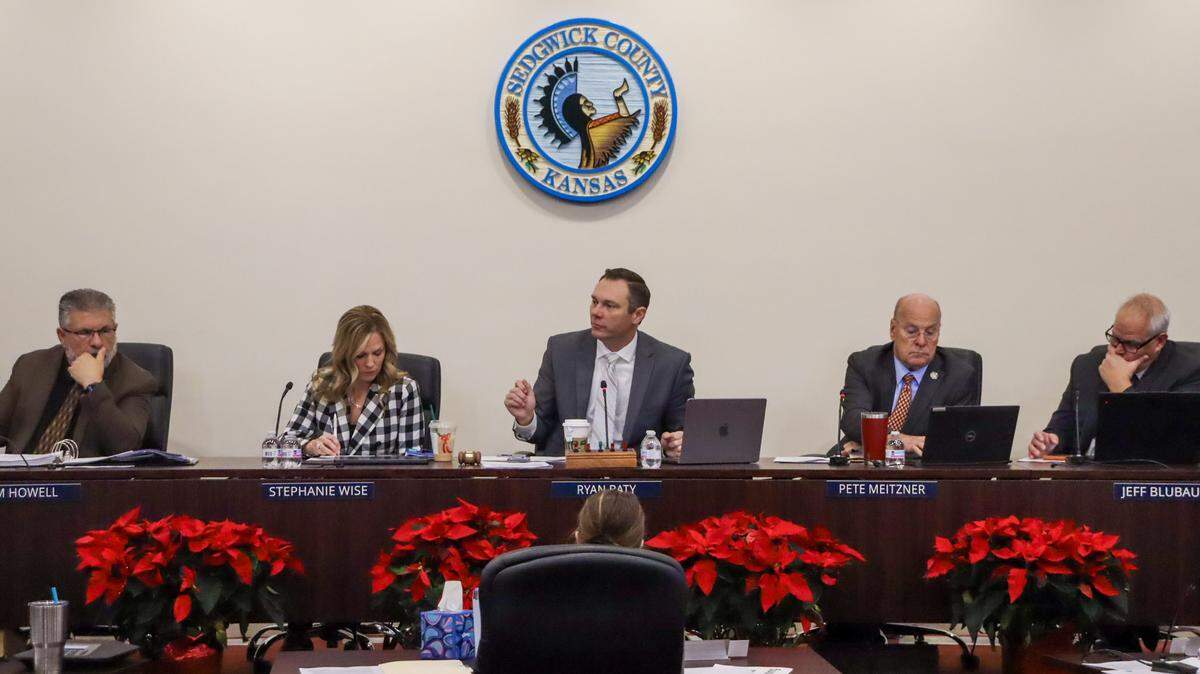 Sedgwick County commissioners listen to a proposal to authorize the transfer of nearly $1.3 million after CivicSource, a New Orleans-based online auction company, failed to pass on proceeds from property tax foreclosure sales.