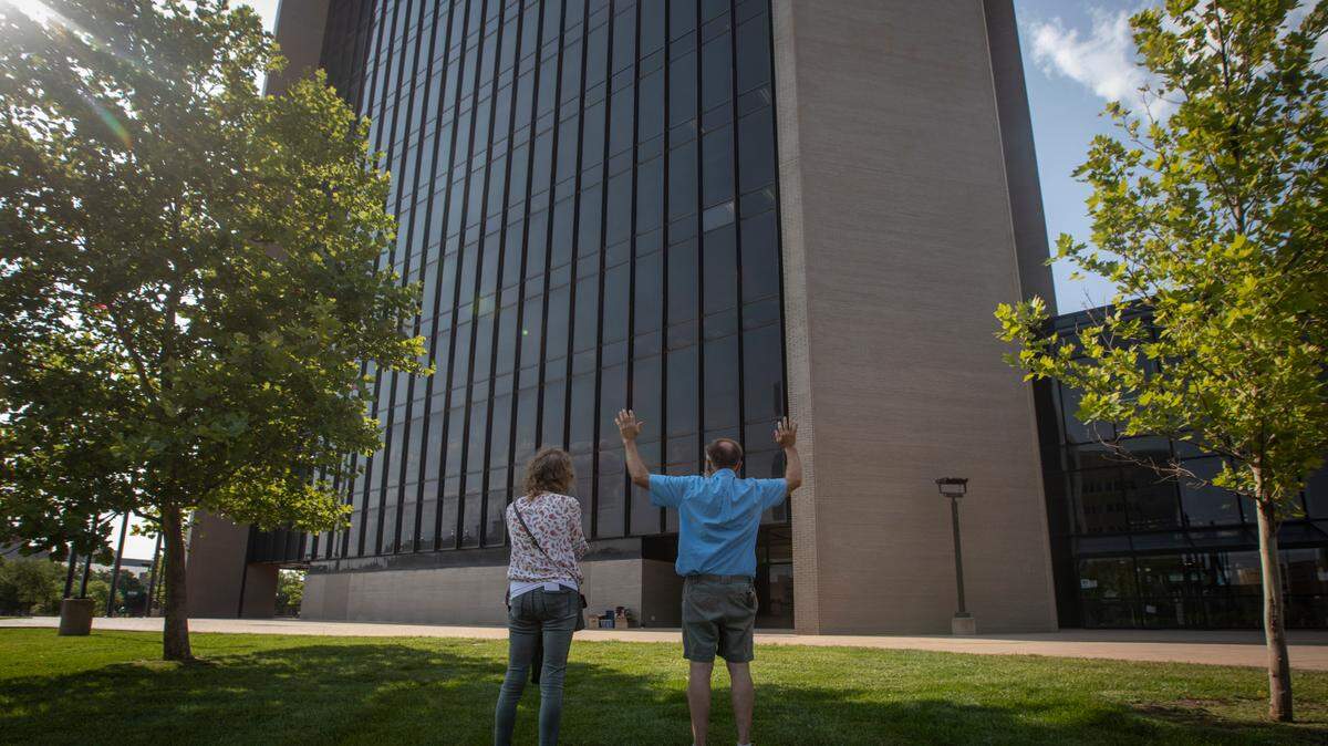 People pray outside of Wichita’s City Hall on Tuesday while inside people spoke before the council regarding at a non-discrimination ordinance under consideration.