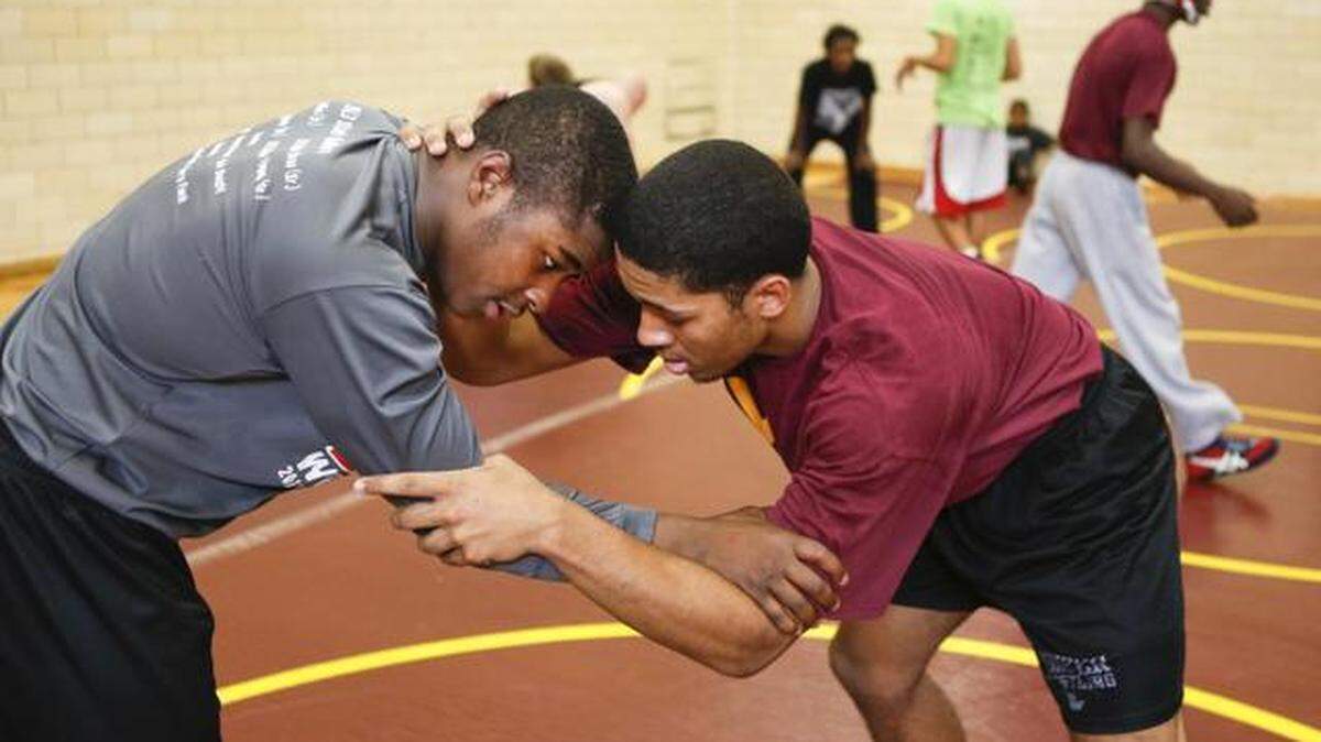 West wrestlers Kalin Collins, left, and Jesse Oliver practice together during a team practice over the Thanksgiving break. (Nov. 27, 2013)
