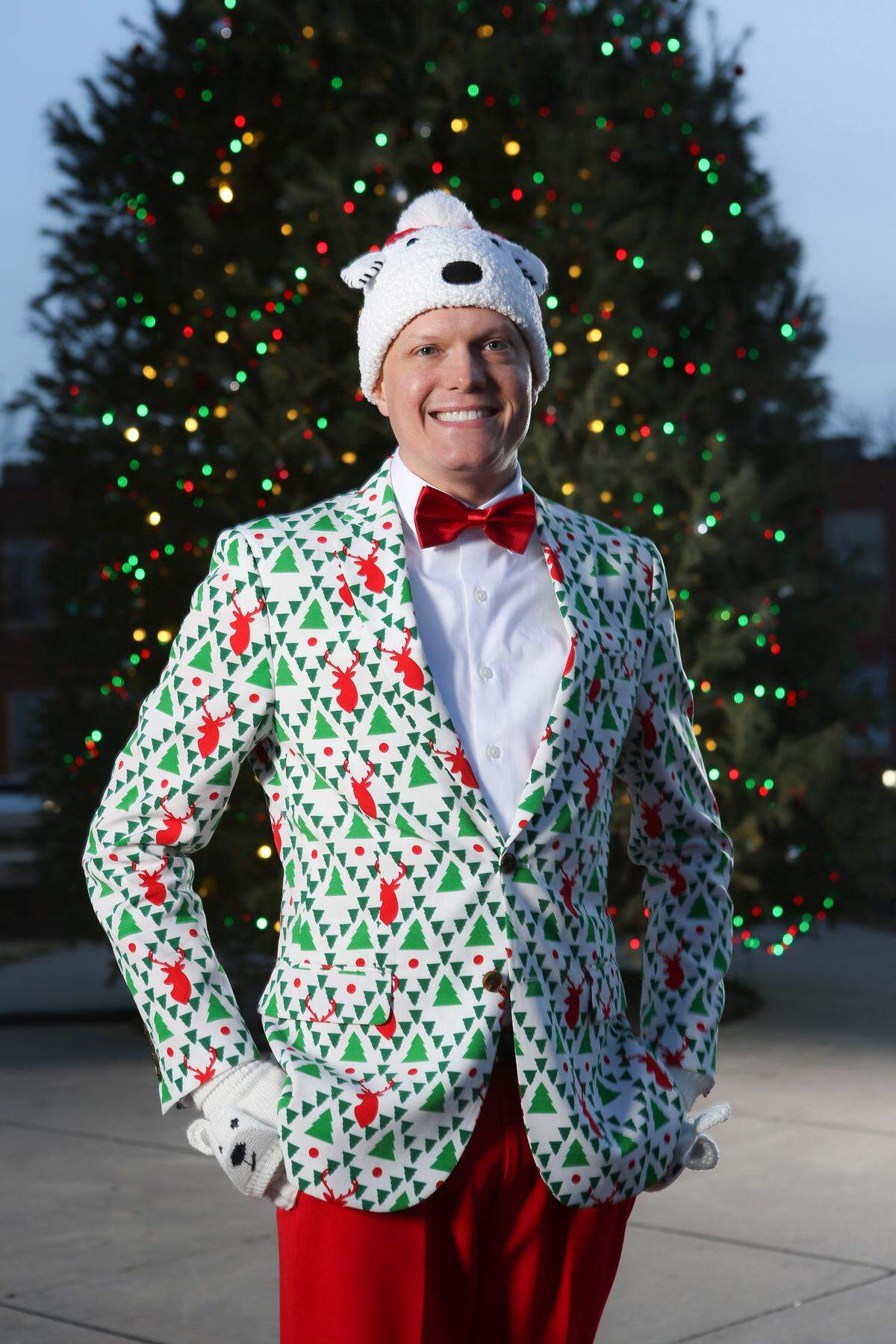 Andy McFayden sports one of his eight Christmas suits in Old Town Square. (December 23, 2018)