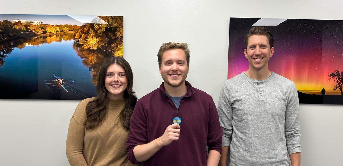Alexander King, center, found the medallion on Tuesday night. Along with him were his fiance, Caitlin Allan, left, and brother, Dominik King, right.