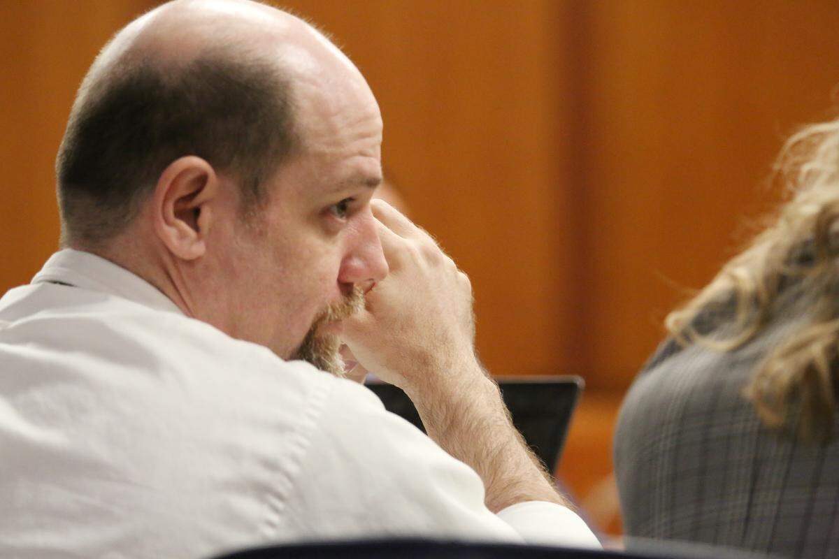 Steven Bodine looks over to one of his attorneys during his murder trial for the death of 3-year-old Evan Brewer. (October 22, 2018)