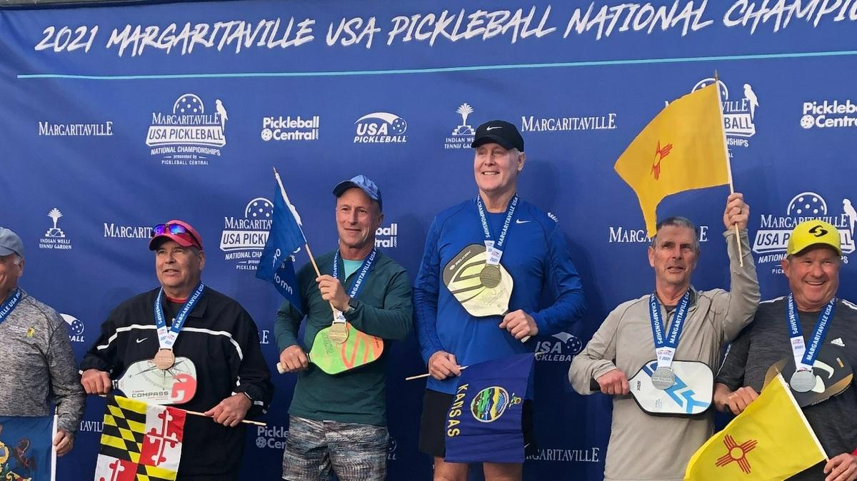 The Wichita natives Dan Hill (right middle) and Tony Greenberg (left middle) won a national championship together in doubles play for their age and skill division in California on Monday evening.