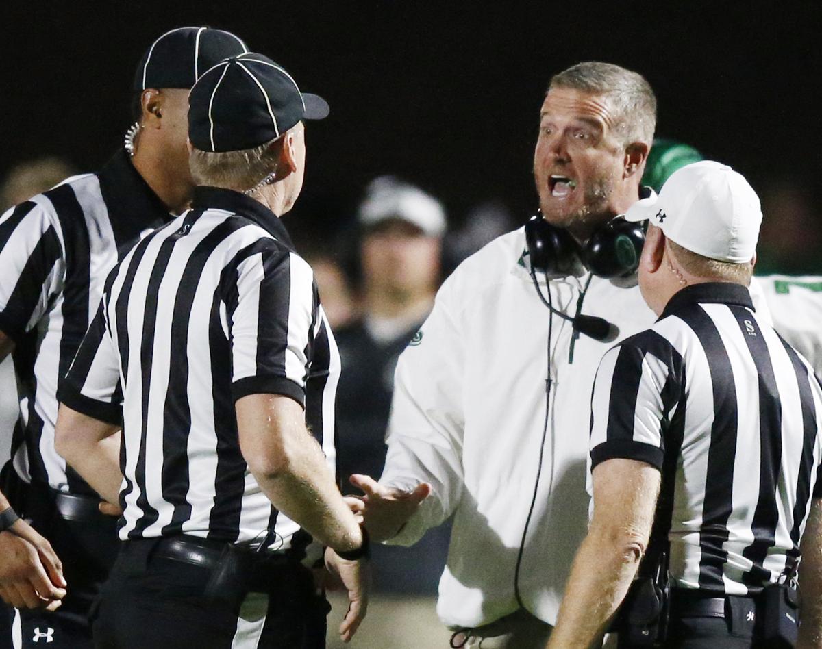 Derby head coach Brandon Clark has some words with officials in the second half Friday night in Maize. (October 19, 2018)