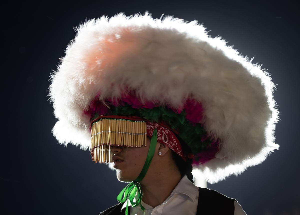 A dancer waits for the start of a parade through north Wichita on Dec. 11 as part of the Virgin of Guadalupe Feast Day. The event commemorates an apparition of the Virgin Mary's before Mexican farmer Juan Diego in 1531.