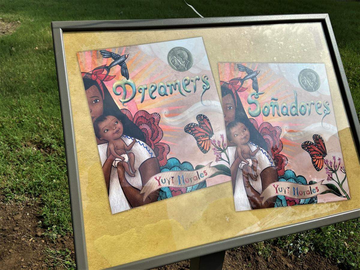 A stop along Evergreen Park’s newly unveiled story walk. The book featured “Dreamers” by Yuri Morales, tells of the author’s experience migrating from Mexico to the United States.